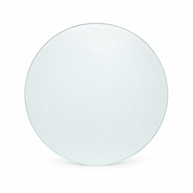 A round, textured clear glass plate or platter shown from a top-down view on a clean white background.